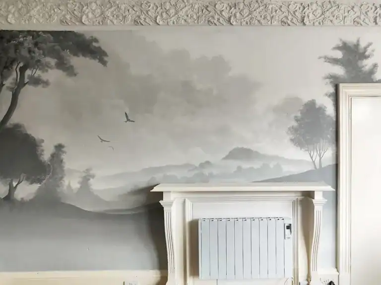 Custom hand-painted wall mural of a classical statue over abstract background in a home